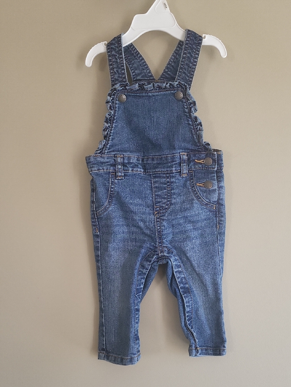 Super cute baby denim overalls with ruffle bib detail